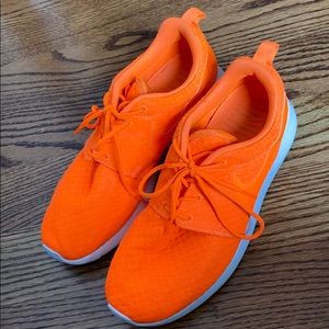 Bright orange running shoes